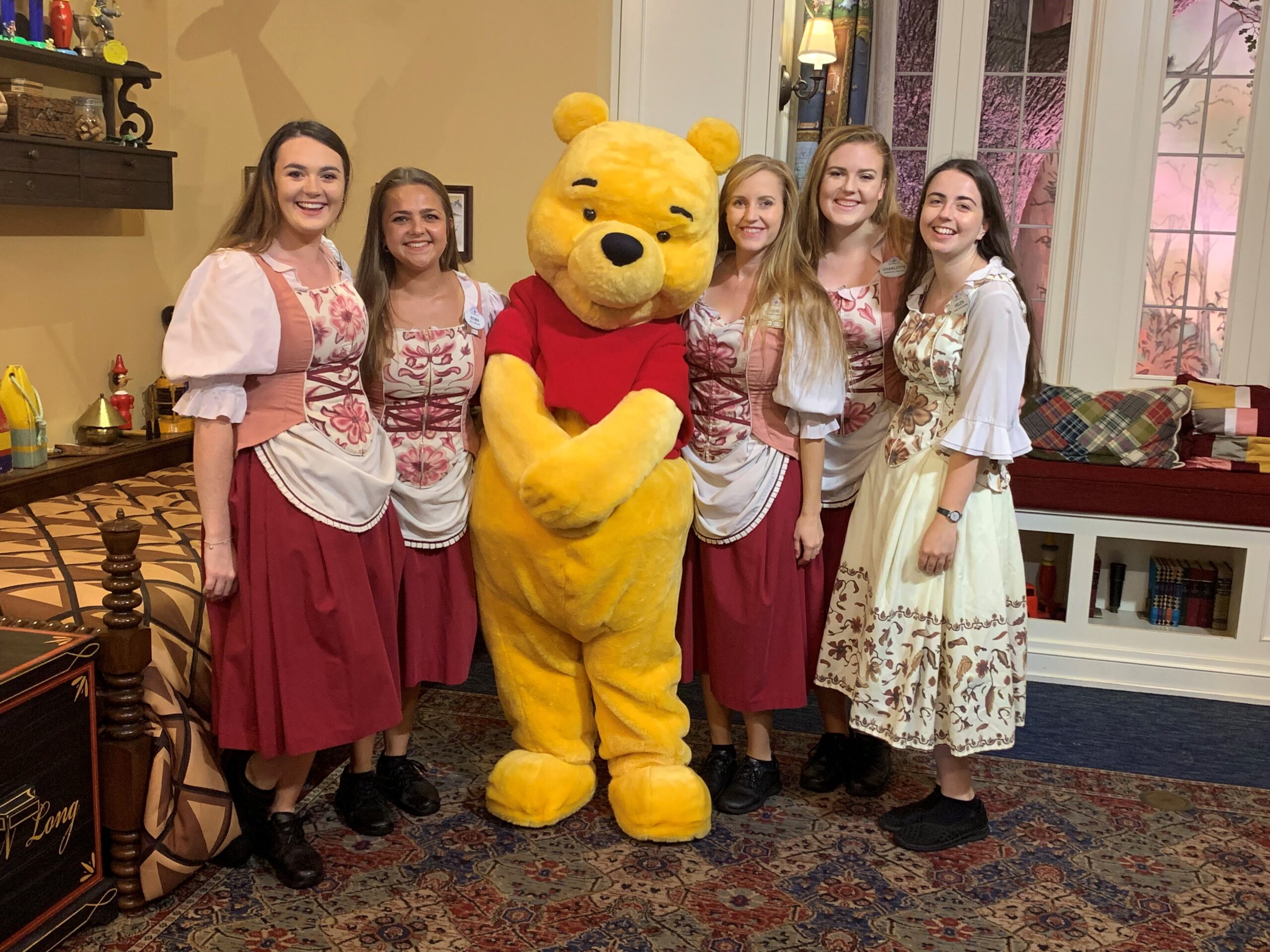 Cast members with Winnie The Pooh in Christopher Robin's room